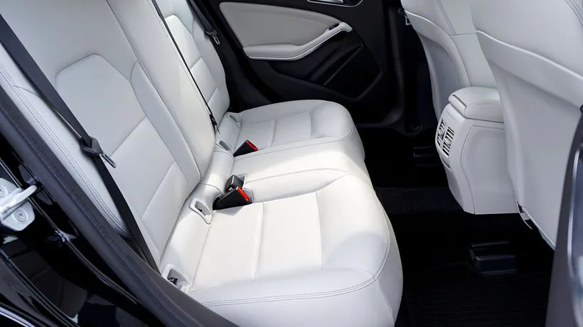 A car seat interior where dust and allergens collect