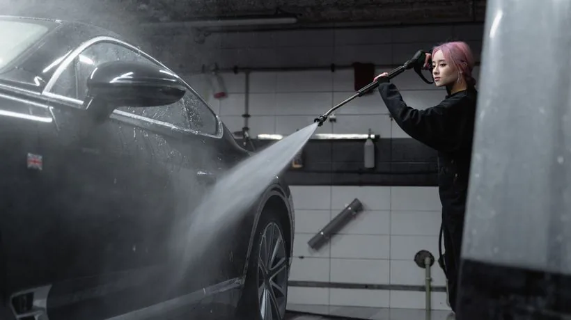 A self-contained mobile valeting setup cleaning a car
