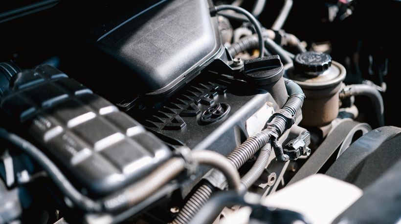 A car engine bay cleaned safely