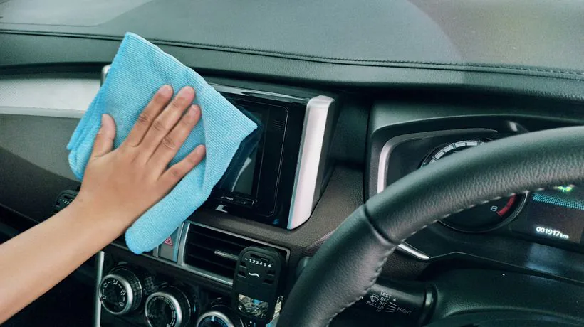 Cleaning a car seat to remove chewing gum and sticky marks