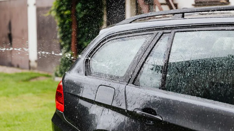 Washing a car to remove tar and bug splatter from the paint