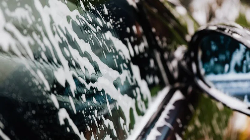 Thick snow foam covering a car as a pre-wash