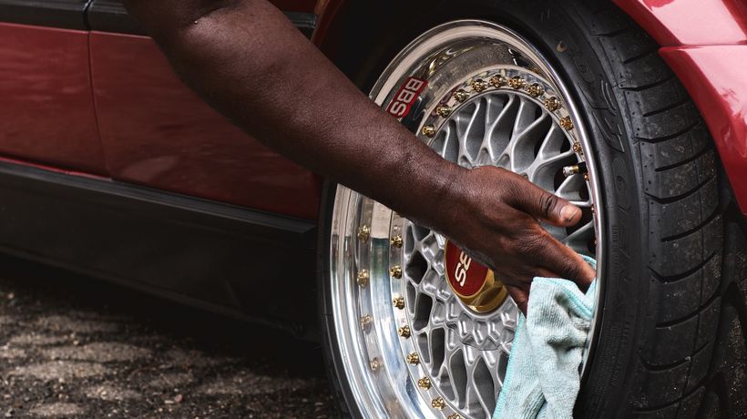 Detailing a car wheel during a thorough spring clean